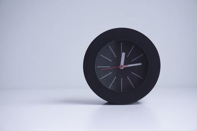 Close-up of clock against white background