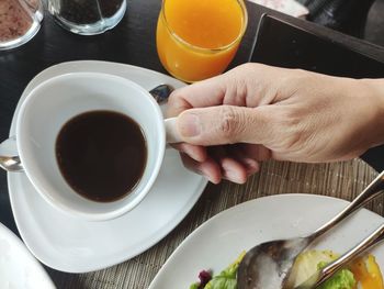 High angle view of coffee cup on table