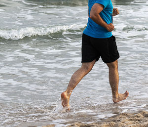 Full length of man standing on beach