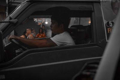 People sitting in car