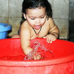 Cute girl playing in water