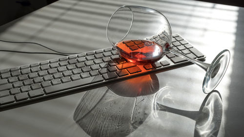 High angle view of wine in glass on table