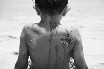 Close-up of boy standing on beach