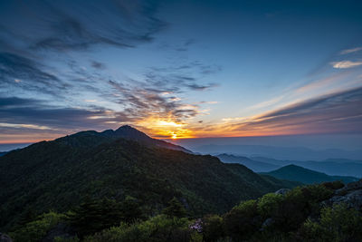 Scenic view of mountains against sky during sunset