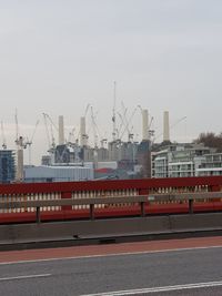 View of factory against cloudy sky