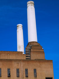 Low angle view of historical building against clear blue sky