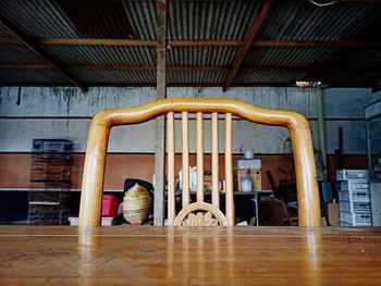 Rear view of men sitting on hardwood floor