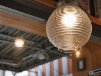 Low angle view of illuminated light bulb