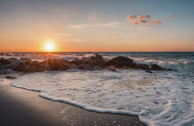 Scenic view of sea against sky during sunset