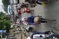 People riding bicycle on road in city