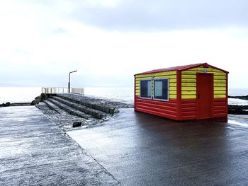 Pier on sea against sky