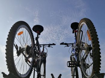 Low angle view of bicycle wheel against sky