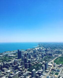 Aerial view of city against clear sky