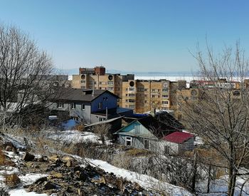 Buildings against sky during winter