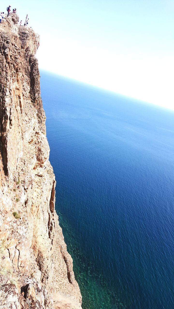 sea, nature, beauty in nature, tranquil scene, tranquility, scenics, water, horizon over water, day, outdoors, idyllic, rock - object, no people, cliff, sky, beach