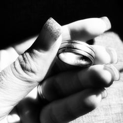 Close-up of hand holding ring