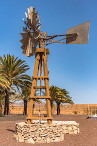 Traditional windmill against clear sky