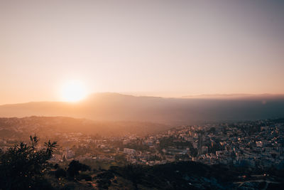 High angle view of townscape against sky during sunset