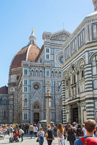 People walking on the piazza del duomo at cattedrale di santa maria del fiore in florence