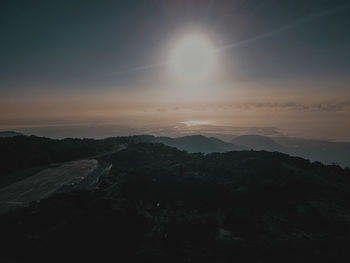 Scenic view of silhouette mountains against sky during sunset