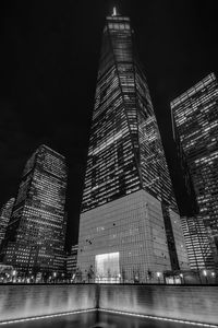 Low angle view of illuminated one world trade center against sky at night