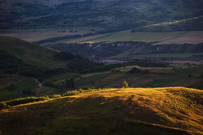 Scenic view of green hilly landscape