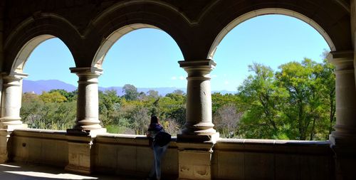 Man looking at archway