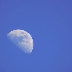 Close-up of moon against blue sky