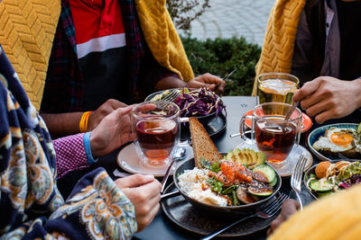 Midsection of people having food