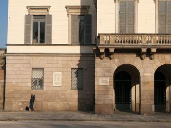 Full length of man standing against building in city