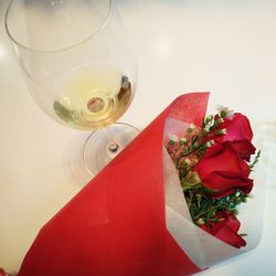 High angle view of red rose on table