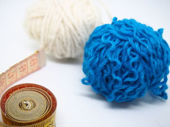 Close-up of wool with tape measure on table