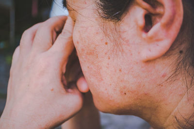 Close-up of woman with hands