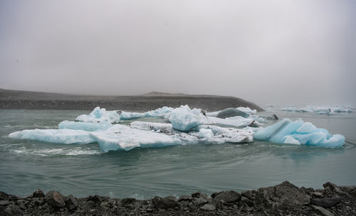 Scenic view of frozen sea against sky