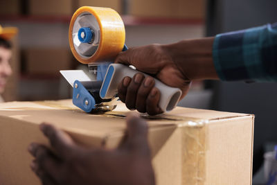 Cropped hands of man working in workshop