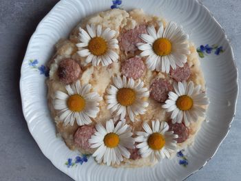 High angle view of white flowers in plate on table