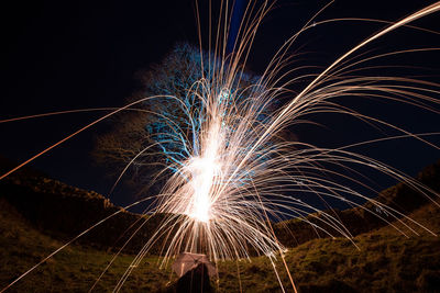 Firework display at night