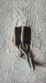 High angle view of rusty metal on wall