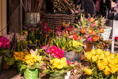 Different flowers and seedlings near the florist flower shop entrance, spring time, easter concept