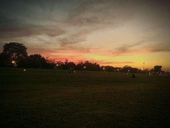 Scenic view of landscape against sky at sunset