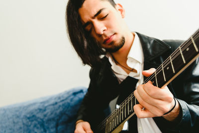 Young man playing guitar