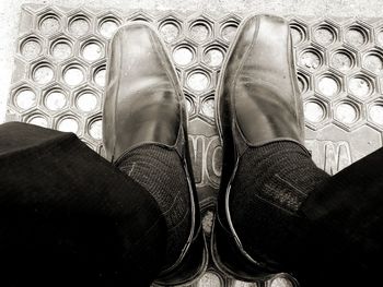 Low section of man standing on floor