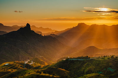 Scenic view of mountains against sky during sunset