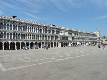 People in front of historical building