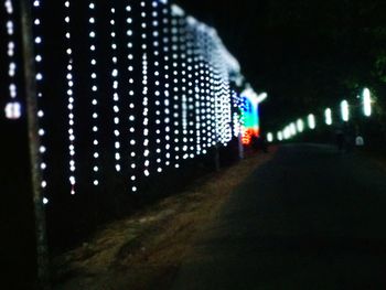 Defocused image of illuminated road at night