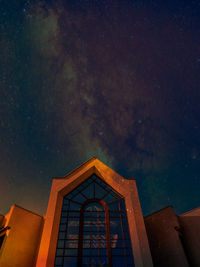 Low angle view of building against sky at night