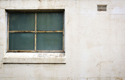 Full frame shot of window on wall of building