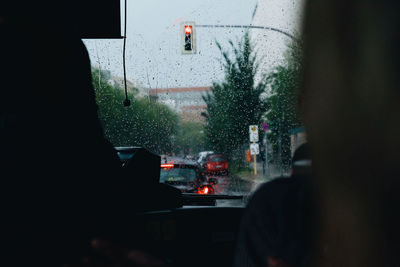 City seen through wet glass window