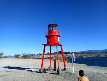 Lighthouse against clear blue sky