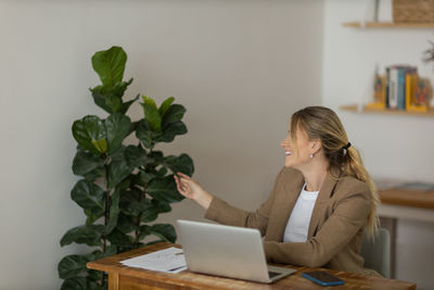 Woman working at home with laptop. home office.  notebook for working. 